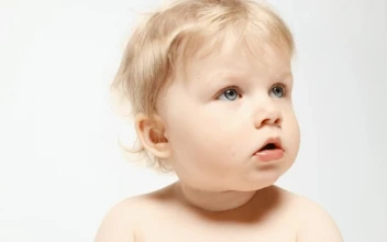 Stock Video Blonde Baby Face In A White Background For PC