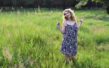 Stock Video Blond Woman In Blue Dress On Meadow For PC