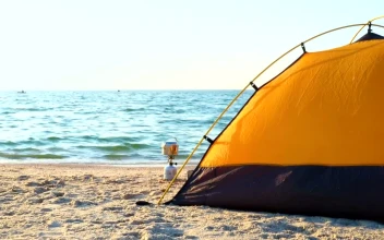 Stock Video Black And Yellow Camping Tent On The Beach For PC