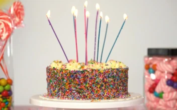 Stock Video Birthday Cake On A Table With Candies On A White For PC