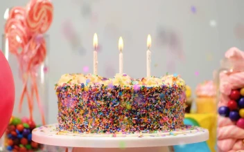 Stock Video Birthday Cake On A Table With Candies And Balloons For PC