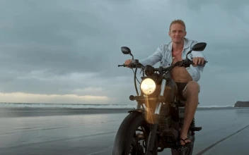 Stock Video Biker Riding His Motorcycle On The Beach For PC