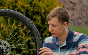 Stock Video Bike Repair Man Spins Wheel And Gives Ok For PC