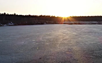 Stock Video Big Frozen Lake Near A Forest For PC