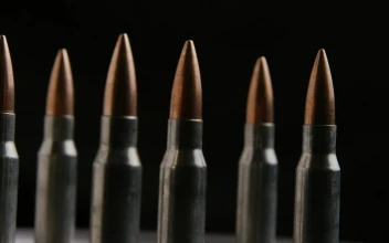 Stock Video Big Bullets Rotating On A Black Background For PC