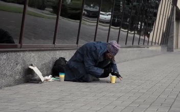 Stock Video Beggar Picking Change From The Street For PC