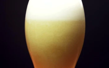 Stock Video Beer Foam Settling In A Glass For PC