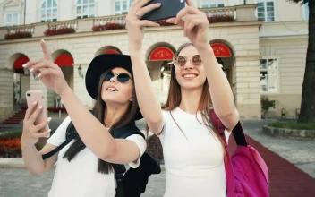 Stock Video Beautiful Tourists Pose For Social Media In European Town For PC