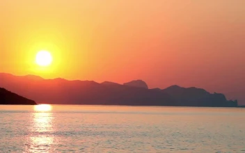 Stock Video Beautiful Sunset Reflected On The Sea Seen From The Beach For PC