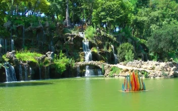 Stock Video Beautiful Lake And Its Waterfalls In A Park For PC