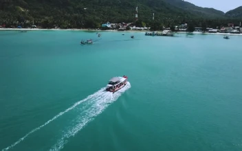 Stock Video Beautiful Coast With Motorboats And A Pier Seen From The For PC