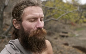 Stock Video Bearded Man Meditates With Closed Eyes In Nature For PC