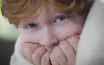 Video Stock Closeup Of Fearful Little Boy Wrapped In Blanket For PC