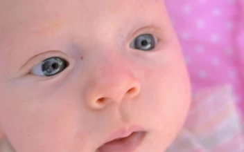 Video Stock Closeup Of A Young Baby Looking Around For PC
