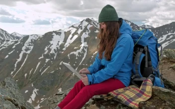 Video Stock Climber Using Her Tablet In The Mountains For PC