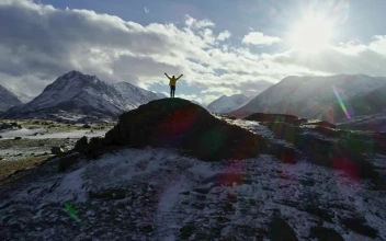 Video Stock Climber Enjoying Freedom On Top Of A Cliff For PC