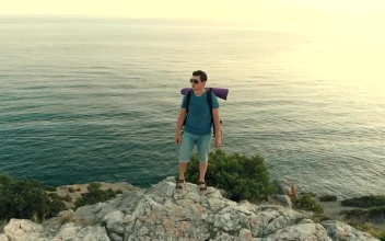 Video Stock Climbed Man On The Rocky Seashore For PC