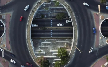 Video Stock City Traffic Going Around A Roundabout From Above For PC