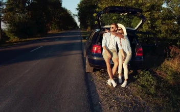 Video Stock Cinematic View Of Couple Sitting On Car In Countryside For PC
