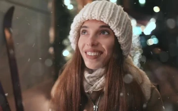 Video Stock Cinematic Of Woman Warming Hands In Nighttime Winter Town For PC