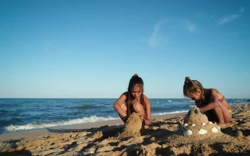Video Stock Children Forming Sand Pyramids On The Beach For PC