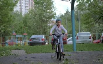 Video Stock Child With Training Wheels On Their Bike For PC