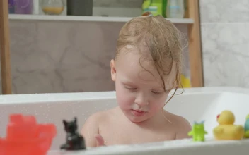 Video Stock Child Playing With Bath Animals For PC