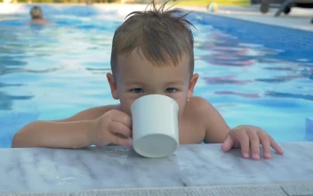 Video Stock Child Drinking From A Cup In The Pool For PC