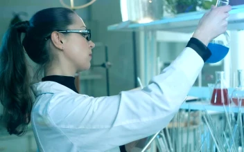 Video Stock Chemist Working In The Laboratory With Her Tablet For PC