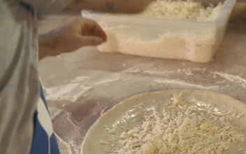 Video Stock Chef Tossing Grated Cheese On A Pizza For PC