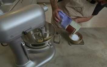 Video Stock Chef Adding Ingredients To An Electric Mixer For PC