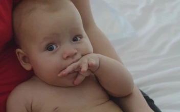 Video Stock Checking The Temperature Of Her Baby For PC