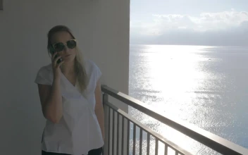 Video Stock Chatting On The Phone While Standing On A Balcony For PC