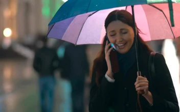 Video Stock Chatting On The Phone Under An Umbrella For PC