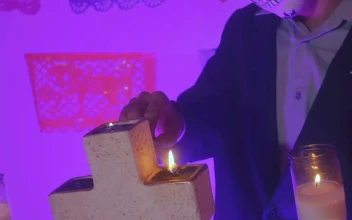 Video Stock Catrin Lighting The Candles Of An Altar Of The Day For PC