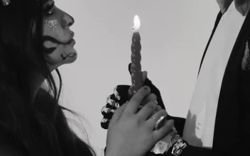 Video Stock Catrin And Catrina Holding Together A Lit Candle For PC