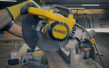 Video Stock Carpenter Operating An Electric Saw In A Workshop For PC