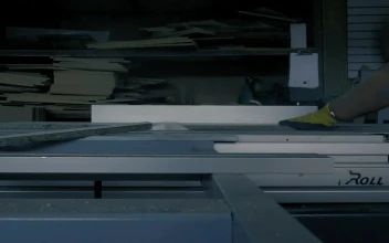 Video Stock Carpenter Cutting A Board On A Table With A Saw For PC