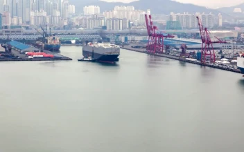 Video Stock Cargo Ship Leaving A Port In A City For PC