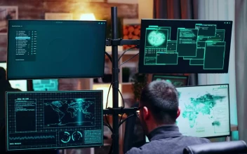 Video Stock Busy Hackers Talk Between Data Visualisations On Monitors For PC
