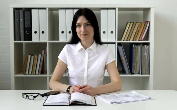 Video Stock Businesswoman Smiling At Her Desk For PC