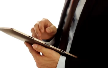 Video Stock Businessman Wearing A Suit And Using A Tablet For PC