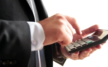 Video Stock Businessman Tallying On A Calculator For PC