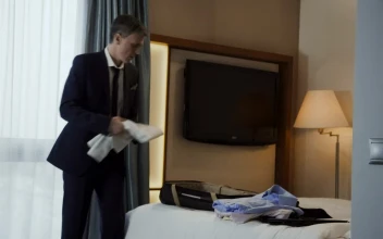 Video Stock Businessman Preparing The Luggage In A Hotel Room For PC