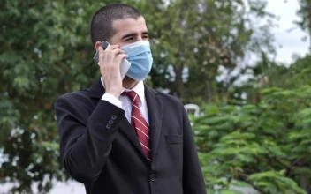 Video Stock Businessman In Suit Wearing Face Mask While Talking On The For PC