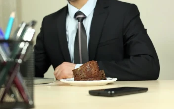Video Stock Businessman Eating While Working At The Computer For PC