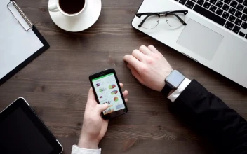Video Stock Businessman Checking Data On His Mobile Phone For PC