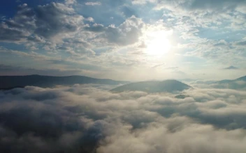 Video Stock Clouds Covering The Top Of A Mountain Range For PC