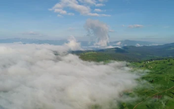 Video Stock Clouds Covering High Mountains In Spring For PC