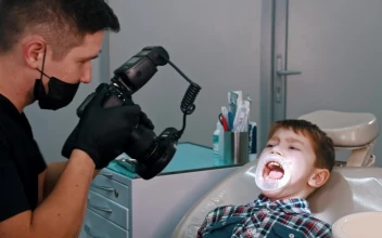 Stock Video Dentist Taking Photos Of A Little Boys Teeth For PC